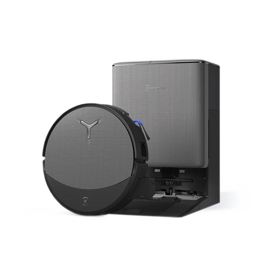 Le robot aspirateur Ecovacs Deebot T90 Pro Omni appuyé contre sa station Omni gris foncé